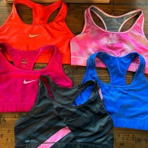 5 Nike Sport Bras - all size large except the dark pink is a medium